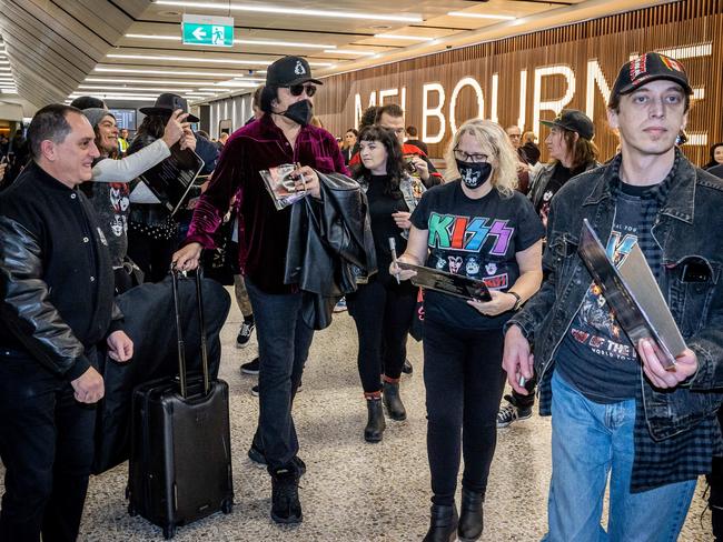 Gene Simmons is flanked by fans upon arrival at Melbourne Airport to begin the Australian leg of the End of the Road Tour. Picture: Jake Nowakowski