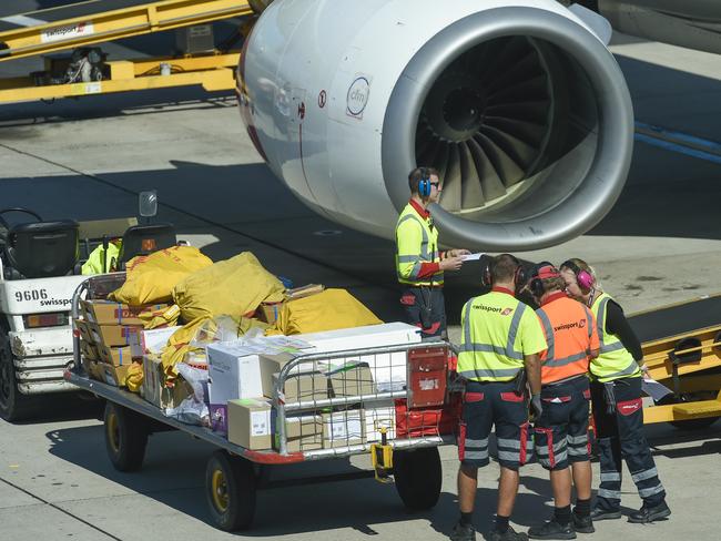 Qantas airport baggage handlers wearing protective gear while the supervisor (Not Sure) but looks as if he was giving orders was not wearing any protective gear at all and was not practising safe distance rules.Thursday April 2 2020.PIC SUPPLIED