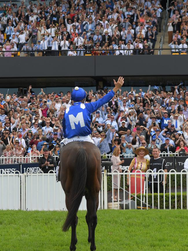 Jockey Hugh Bowman salutes the crowd after Winx wins race 5, The Agency George Ryder Stakes during Golden Slipper Day at Rosehill Gardens Racecourse . Picture: AAP