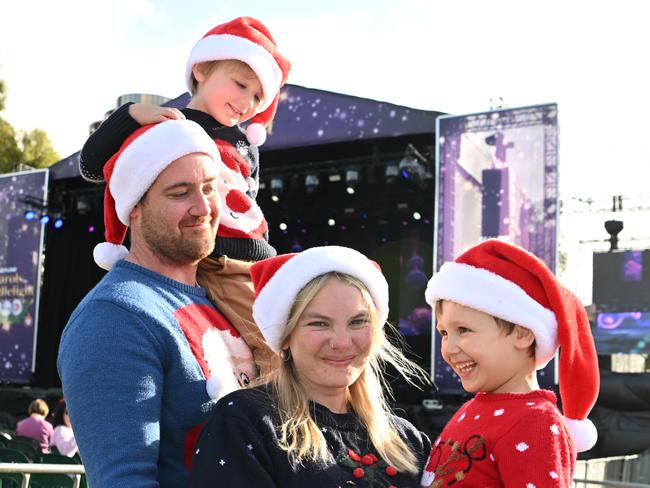 Michael and Taiten, 3, Amelia and Leo Faturik, 6, from Seaford Meadows at the Sealink Carols By Candlelight in Elder Park, Tarntanya, Kaurna Yarta, Adelaide on Sunday, December 11, 2022. (The Advertiser/ Morgan Sette)