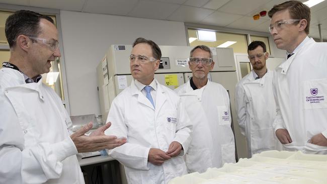 Federal Health Minister Greg Hunt MP (second left) speaks with Professor Trent Munro (left) during a visit to the National Biologics Facility at the University of Queensland, St Lucia. The university is in phase 1 of clinical trials for the COVID 19 vaccine. Picture: NCA NewsWire / Sarah Marshall