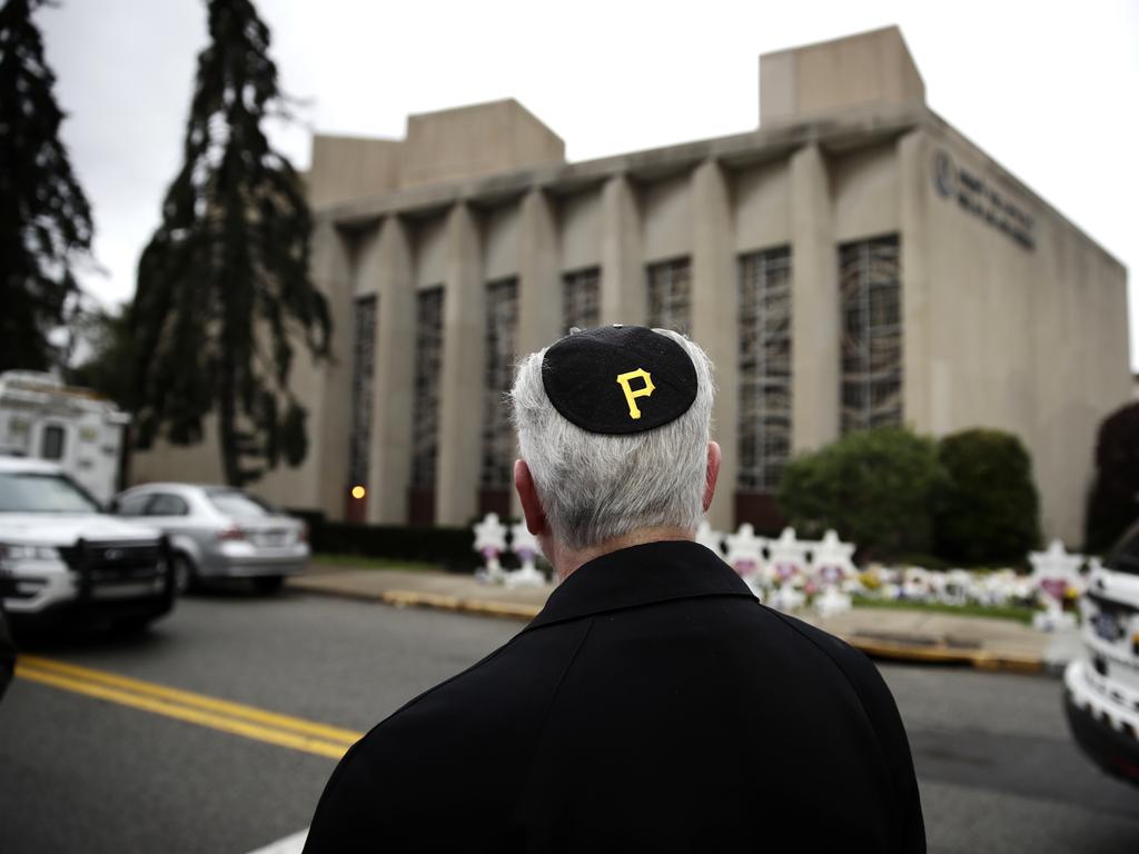 Rabbi Jeffrey Myers stands near the synagogue and wears a yarmulke with a Pittsburgh Pirates logo. Picture: AP