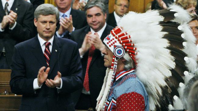 Former Canadian prime minister Stephen Harper and other members of parliament give First Nations chief Phil Fontaine a standing ovation as he rises to respond to the official apology for the Indian Residential Schools.