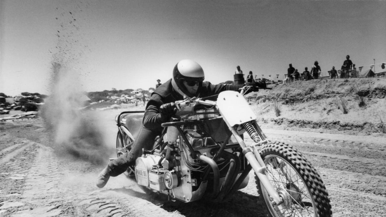 Man on motorcycle at the sand drags, at Ponde rock music festival, held by the Hell's Angels Motorcycle Club in Ponde near Mannum, SA, 17 Feb 1996.