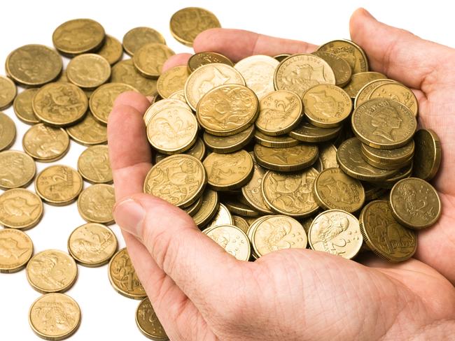 Young hands holding golden Australian coins. money, generic