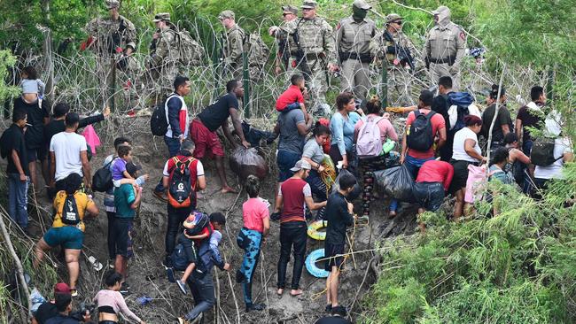 Migrant people try to get to the US through the Rio Grande as seen from Matamoros, state of Tamaulipas, Mexico. Picture: AFP