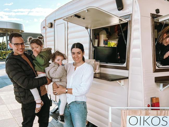 Oikos owners Brett and Christie Briggs with their children Frankie and Feli outside their new coffee caravan at Tulmur Place.