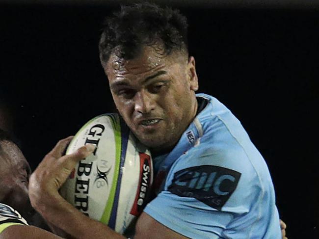 SYDNEY, AUSTRALIA - FEBRUARY 16: Karmichael Hunt of the Waratahs is tackled during the round one Super Rugby match between the Waratahs and the Hurricanes at Brookvale Oval on February 16, 2019 in Sydney, Australia. (Photo by Brook Mitchell/Getty Images)