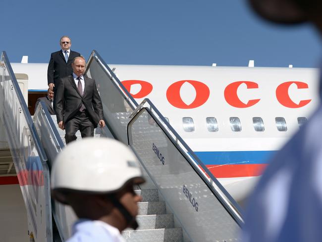 Russia's President Vladimir Putin descends from his plane.