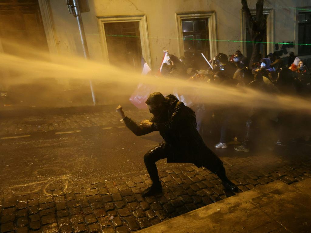 Riot police used water cannons to break up protesters. Picture: Giorgi ARJEVANIDZE / AFP