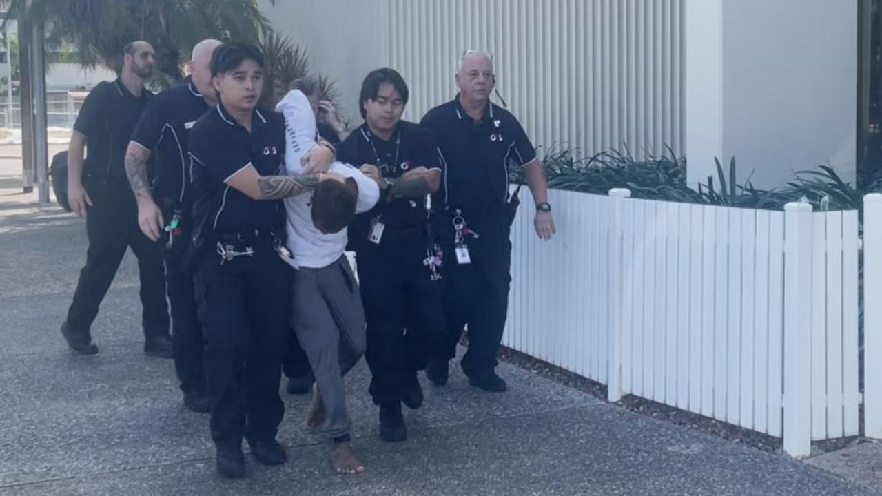 Ezra Austral was restrained by security after evading G4S court security, jumping over the barrier and running down the street at Darwin Local Court on Thursday, May 29. Picture: Zizi Averill