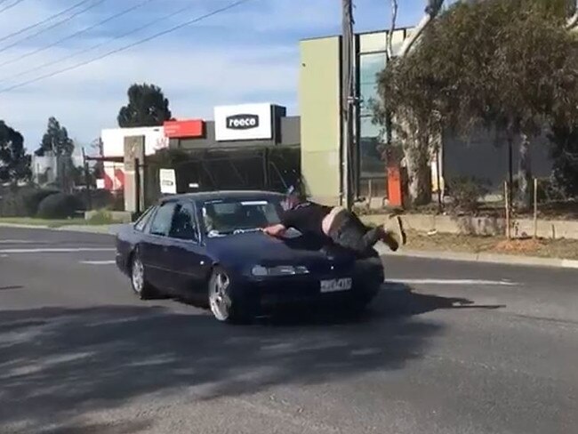 The moment a man is hit by a car allegedly doing a burnout.