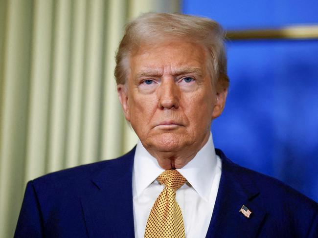 US President-elect Donald Trump looks on during a meeting with France's President at the Elysee Palace in Paris, on December 7, 2024. Trump makes his first international trip since his election win, preparing for a day of intense diplomacy before attending the reopening ceremony for the Notre Dame cathedral restored after the 2019 fire. (Photo by Sarah Meyssonnier / POOL / AFP)