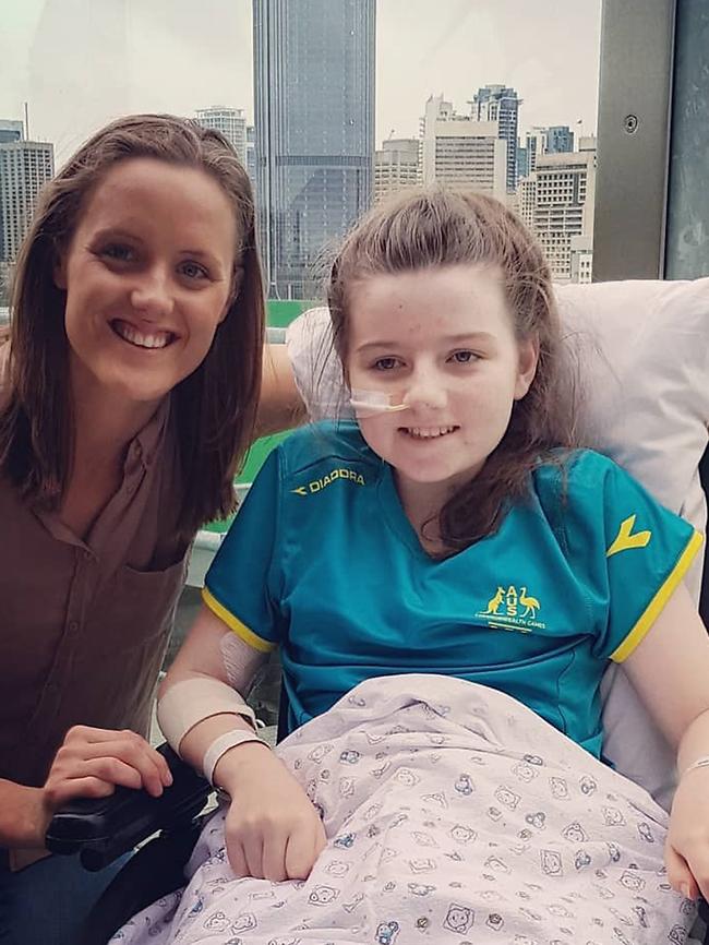 Hannah Papps is visited by paralympian Ellie Cole after she lost her leg in a shark attack.