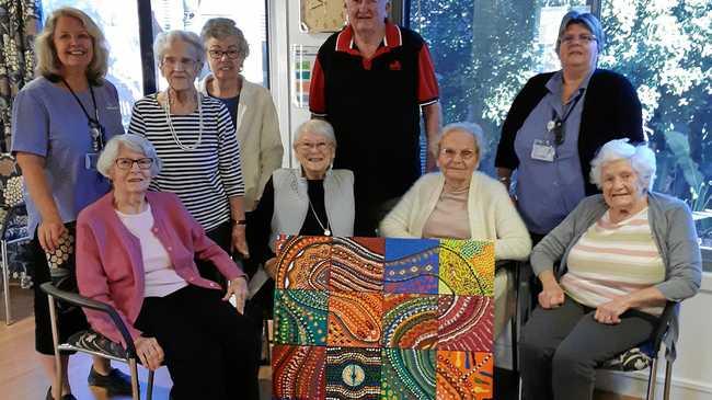 ENTHUSIASTIC PARTICIPANTS: Buderim Views aged-care residents learnt dot painting during Naidoc Week. They are pictured with their finished piece. Picture: Contributed