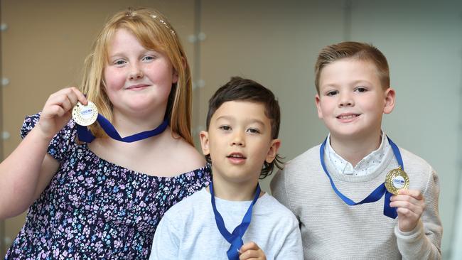 Twenty-one outstanding new Junior Triple Zero Heroes will be recognised for their exceptional courage and maturity while calling Triple Zero (000).  Junior Triple Zero Heroes Jorja Gardiner 8, Ace Cope 6 and Miles Taylor 7 with their medals.                     Picture: David Caird