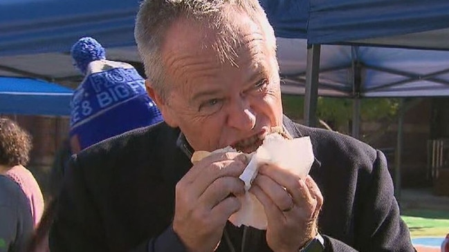 Bill Shorten's strange sausage eating technique is on show again. Picture: Nine News