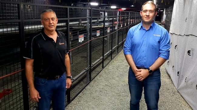 Resources Centre of Excellence CEO Steven Boxall (left) stands with Vayeron engineer and entrepreneur Ryan Norris, the first innovator in residence, by the replica conveyor system. Picture: Duncan Evans