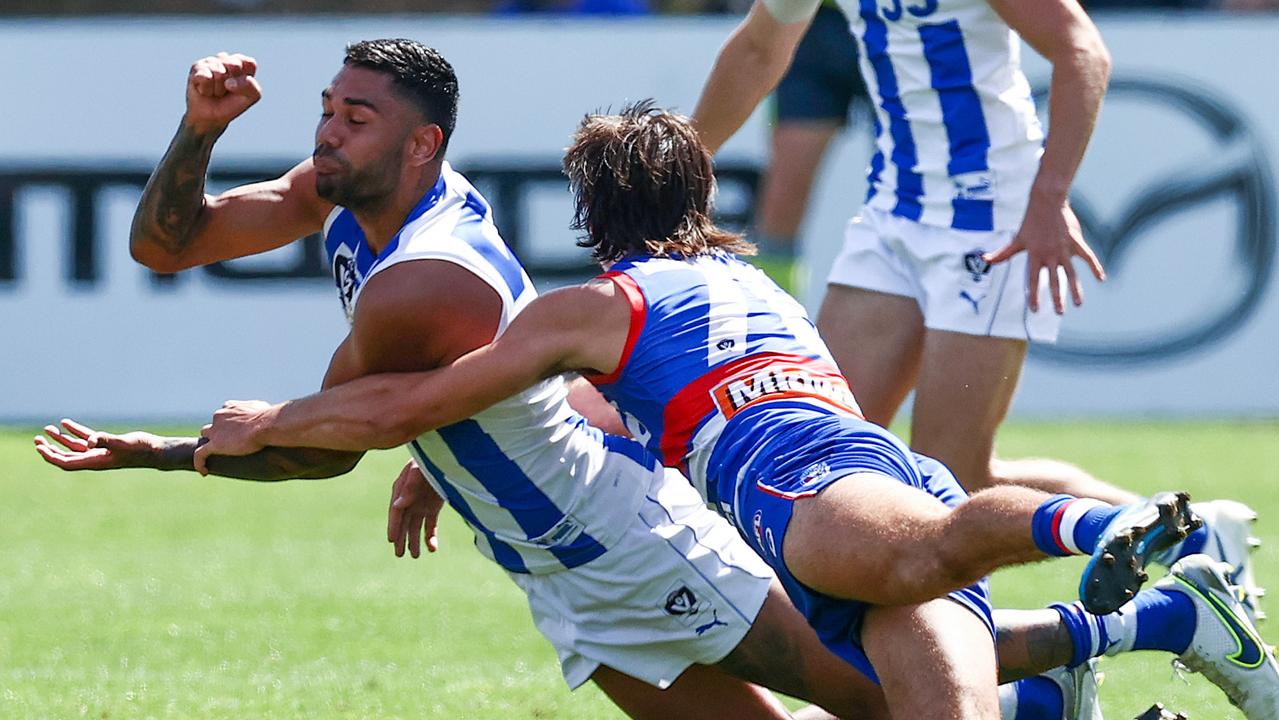 Tarryn Thomas gets a handball away. Picture: Michael Klein