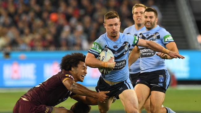 NSW hooker Damien Cook makes a break during State of Origin 1. Photo: AAP