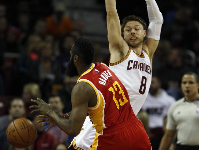 Matthew Dellavedova of the Cleveland Cavaliers defends against James Harden of the Houston Rockets on February 20.