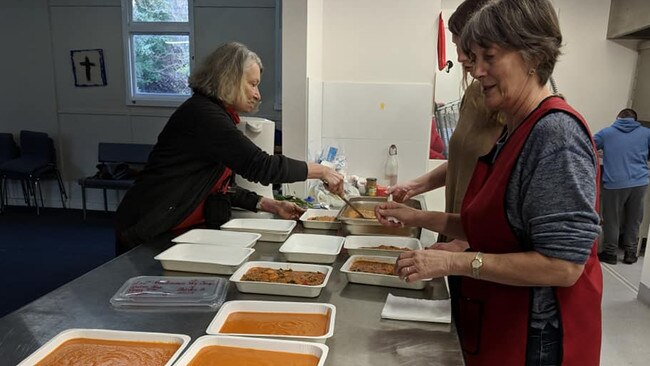 Community Casserole volunteers putting meals together.