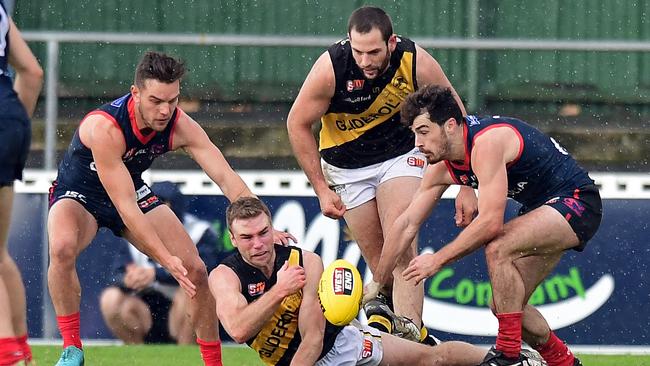 Glenelg's Andrew Bradley under pressure. Picture: Tom Huntley