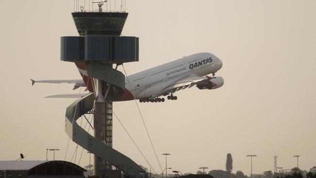 A Qantas Airbus A380 superjumbo takes off past the Air Traffic Control tower at Mascot Airport in Sydney 27/11/2010. The superjumbo took off from Sydney on Saturday on the first A380 passenger flight for the airline since a midair engine explosion earlier this month triggered a global safety review.