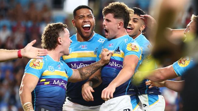 Toby Sexton celebrates a try against the Dragons. (Photo by Chris Hyde/Getty Images)