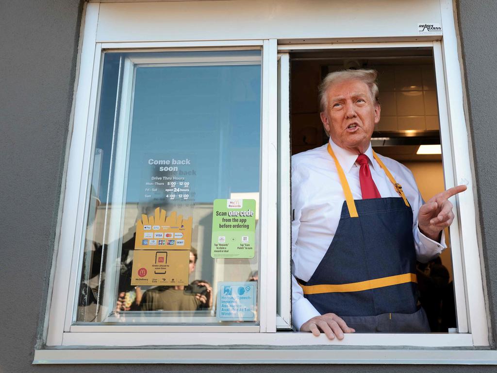 Customers were shocked to see Trump passing out McDonald’s bags in the drive-thru. Picture: Getty Images via AFP