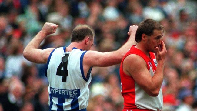 The contrasting emotions of Mick Martyn and Tony Lockett at the end of the 1996 Grand Final.