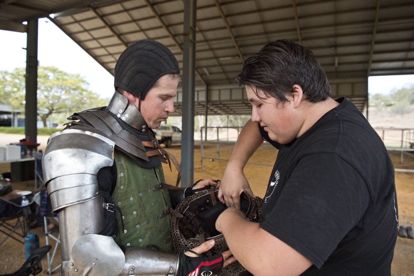 Kyle Weblin (left) is made battle ready with help from Kael Yamasita.