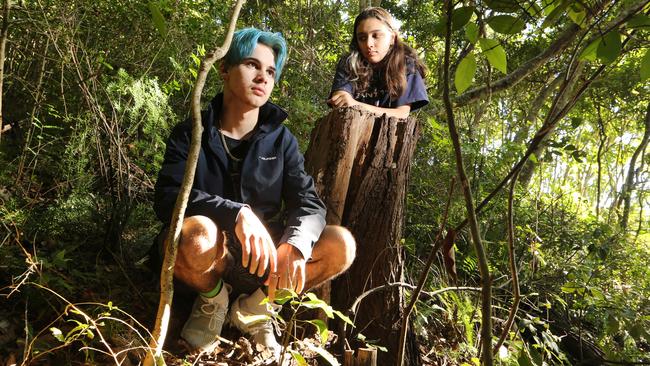 Burleigh Heads parkis being overrun by noxious weeds. Visitors Jett Righetti 17 and Kiana Schokman 16 ,from Brisbane were shocked to find the majority of greenery were weeds. . "We thought it looked fin at first until we learned how much were weeds." Picture Glenn Hampson