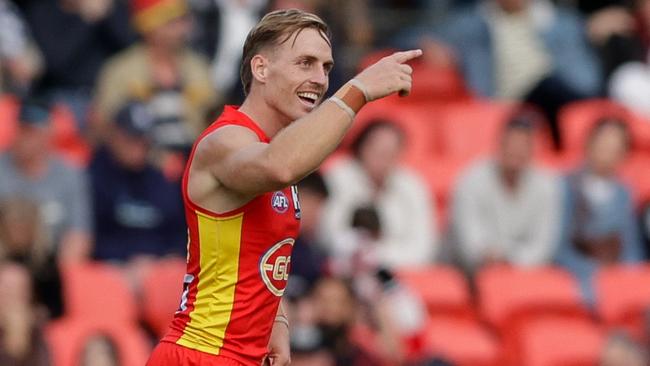 GOLD COAST, AUSTRALIA - JULY 15: Darcy Macpherson of the Suns celebrates a goal during the 2023 AFL Round 18 match between the Gold Coast Suns and the St Kilda Saints at Heritage Bank Stadium on July 15, 2023 in the Gold Coast, Australia. (Photo by Russell Freeman/AFL Photos via Getty Images)