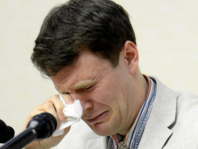 US student Otto Frederick Warmbier wipes away his tears as he speaks at a press conference in Pyongyang. Picture: AFP/KCNA