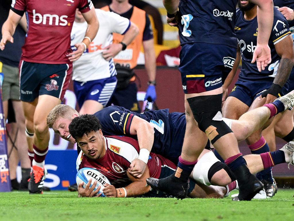 Hunter Paisami scores a try for the Reds during the shutout win against the Highlanders. Picture: Getty Images