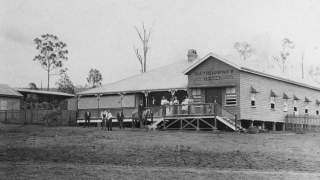 The Rathdowney Hotel was built in 1915. One man is riding a horse and another person is on a bicycle. There is a horsedrawn cart in the background. Picture: State Library of Queensland collection: Beyond the Battlefield