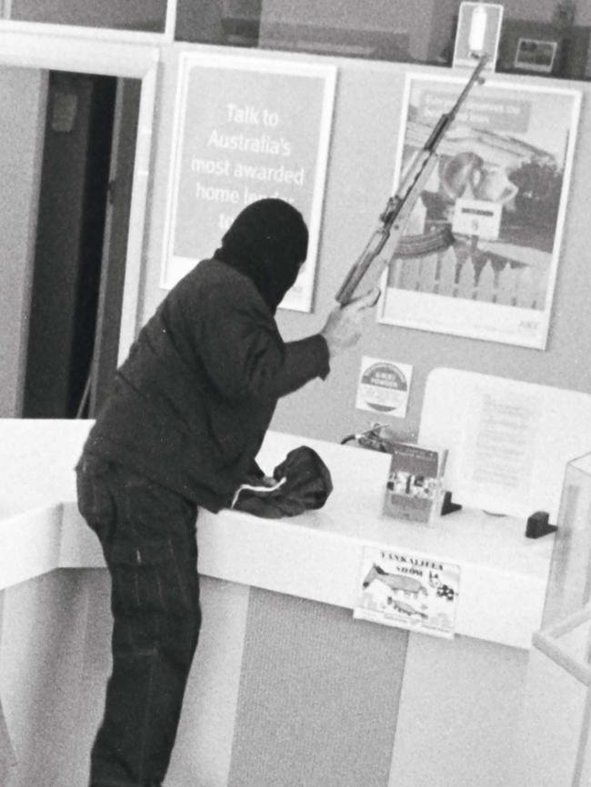 Video surveillance image of the SA criminal known as the Bicycle Bandit a robbing bank branch at Yankalilla in December 2007.