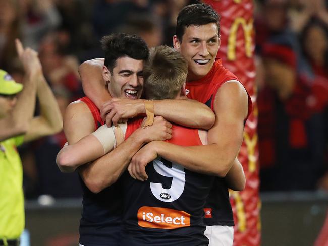 Charlie Spargo celebrates a goal with Christian Petracca and Sam Weideman. Picture: Phil Hillyard