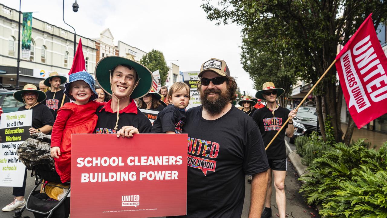 Supporting the United Worekers Union are Tom Keighran (left) holding Mili and Zac Burton holding Posie at the Labour Day 2022 Toowoomba march. Picture: Kevin Farmer