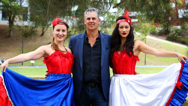 Parramasala festival director Paul Osbourne with French CanCan performers at the launch of the Parramasala. Picture: AAP / Angelo Velardo