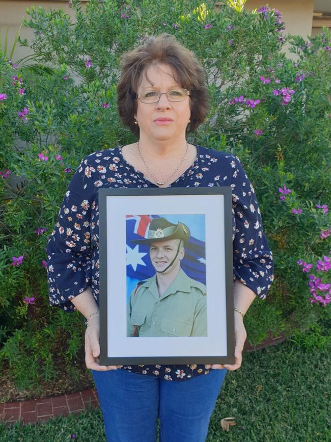 Colleen Pillen with a picture of her son, Michael.