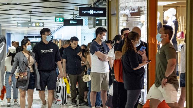 Shoppers lined up outside some stores as Boxing Day crowds starting to show arrive in the city. Picture: Monique Harmer