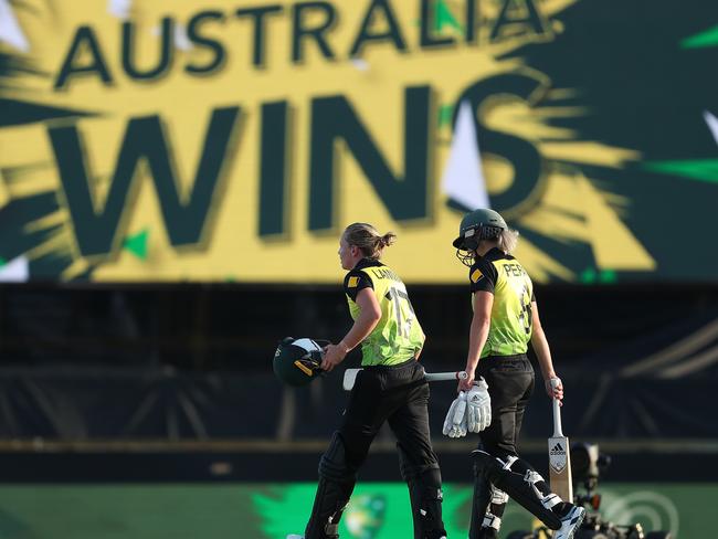 Meg Lanning, left, and Ellyse Perry of Australia walk from the field after winning the ICC Women's T20 Cricket World Cup match between Australia and Sri Lanka at the WACA on February 24. Picture: PAUL KANE/GETTY IMAGES