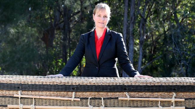 Esther Swanborough from Swanborough Funerals in south-east Queensland, with a natural fibre casket. Photo: Renae Droop