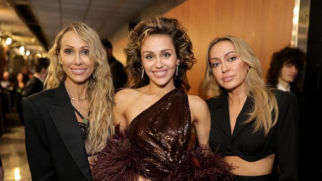 (Left to right) Tish Cyrus, Miley Cyrus and Brandi Cyrus attend the 66th Grammy Awards in Los Angeles. Picture: Neilson Barnard/Getty Images.