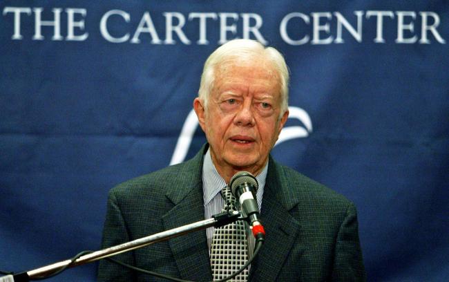 Former US President Jimmy Carter, pictured at a 2004 press conference, was a noted humanitarian in his post-presidency