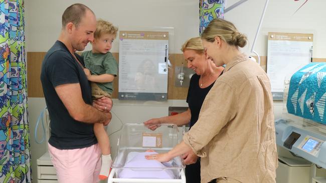 Parents Andrew and Loren Barton with their sons Henry and newborn Edison Barton in the special care nursery, with midwife Ali McKill. Picture: Letea Cavander