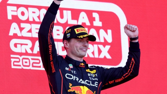 BAKU, AZERBAIJAN - JUNE 12: Race winner Max Verstappen of the Netherlands and Oracle Red Bull Racing celebrates on the podium during the F1 Grand Prix of Azerbaijan at Baku City Circuit on June 12, 2022 in Baku, Azerbaijan. (Photo by Clive Rose/Getty Images)