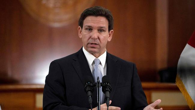 Florida Governor Ron DeSantis answers questions from the media in the Florida Cabinet following his State of the State address. Picture: AFP.